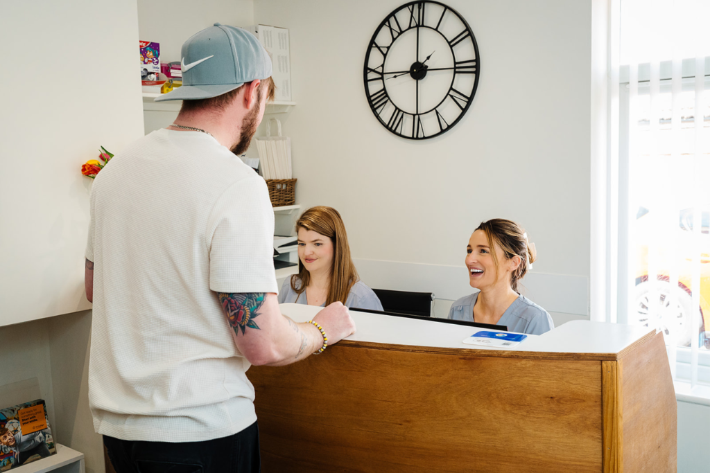 Dental patient at Toftwood Dental Practice, booking a mini dental appointment